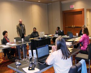 Participants engaged in discussion during presentation