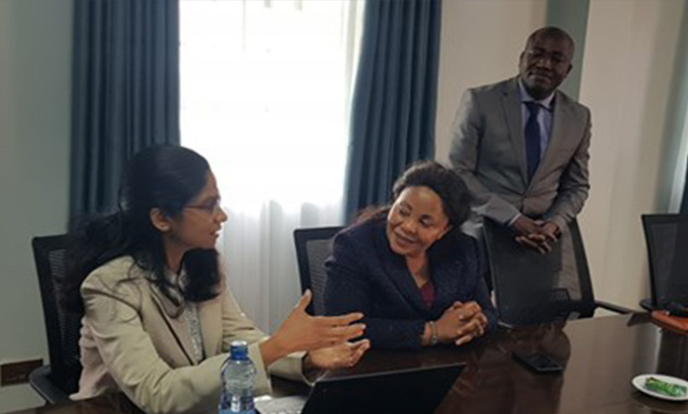 Two women participants discussing among themselves during workshop.