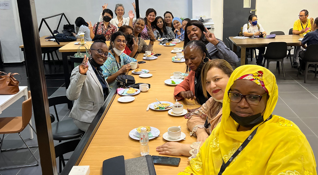 Women participants posing for a photo during tea break