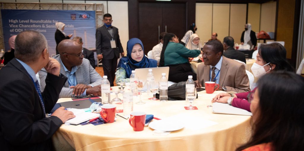 Delegates discussing among themselves during the conference