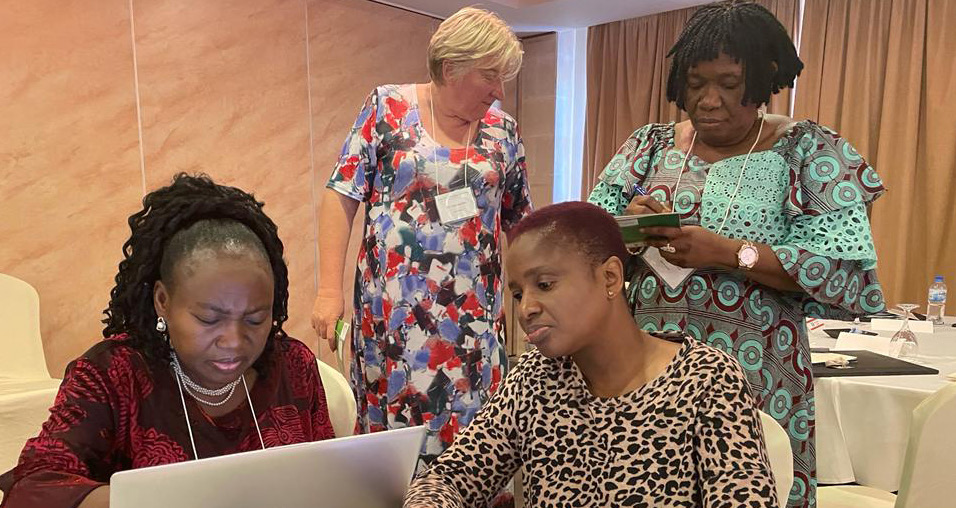 Participants taking down notes during the meeting