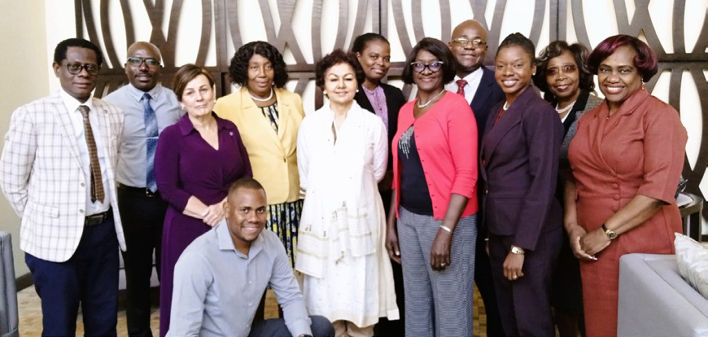 Meeting participants posing for group photograph with Prof Asha Kanwar